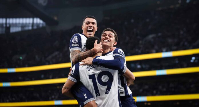 Dominic Solanke of Tottenham Hotspur celebrates with teammates Pedro Porro and Brennan Johnson after scoring his team's second goal during the Premier League match between Spurs and Aston Villa FC at Tottenham Hotspur Stadium on November 03, 2024 in London, England.