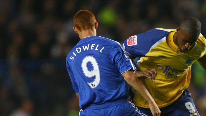 Steve Sidwell of Chelsea of Chelsea tackles Carl Cort of Leicester City during the Carling Cup Fourth Round match between Chelsea and Leicester City at Stamford Bridge on October 31, 2007 in London, England.