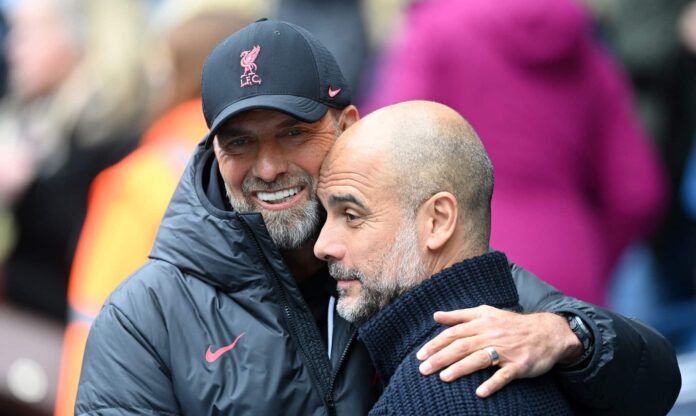 Jurgen Klopp, Manager of Liverpool, embraces Pep Guardiola, Manager of Manchester City, prior to the Premier League match between Manchester City and Liverpool FC at Etihad Stadium on April 01, 2023 in Manchester, England.