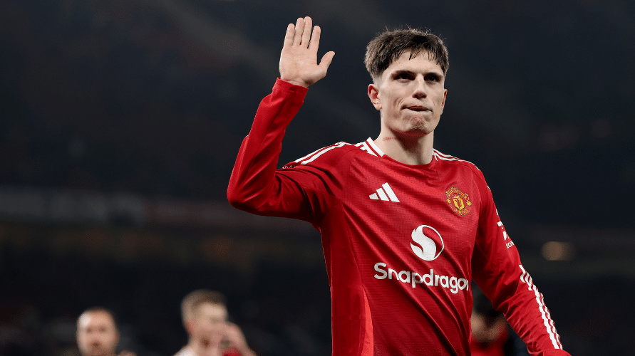 Man United winger Alejandro Garnacho gestures to the crowd during a Premier League match.