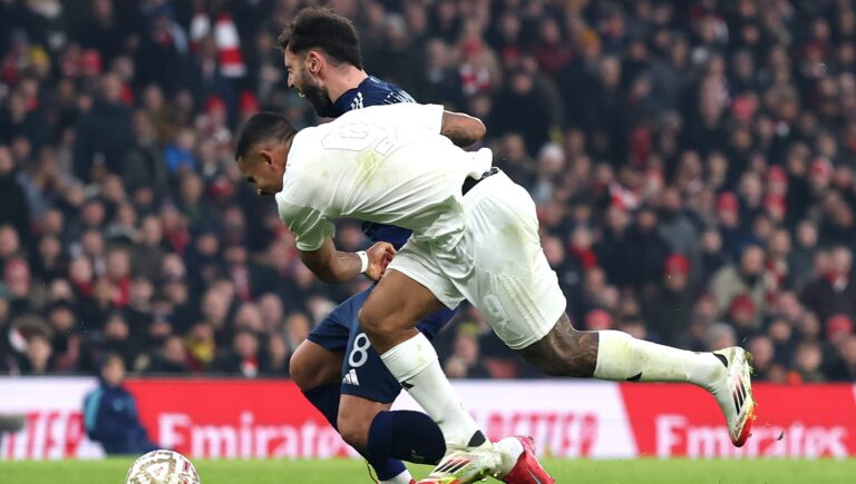 Bruno Fernandes of Manchester United is challenged by Gabriel Jesus of Arsenal who then has to leave the pitch with a injury during the Emirates FA Cup Third Round match between Arsenal and Manchester United at Emirates Stadium on January 12, 2025 in London, England.