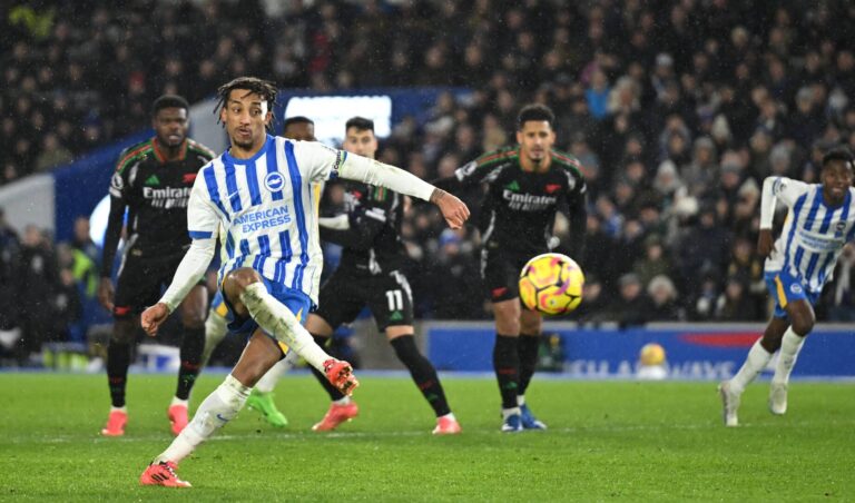 Joao Pedro of Brighton & Hove Albion scores his team's first goal from a penalty kick during the Premier League match between Brighton & Hove Albion FC and Arsenal FC at Amex Stadium on January 04, 2025 in Brighton, England.