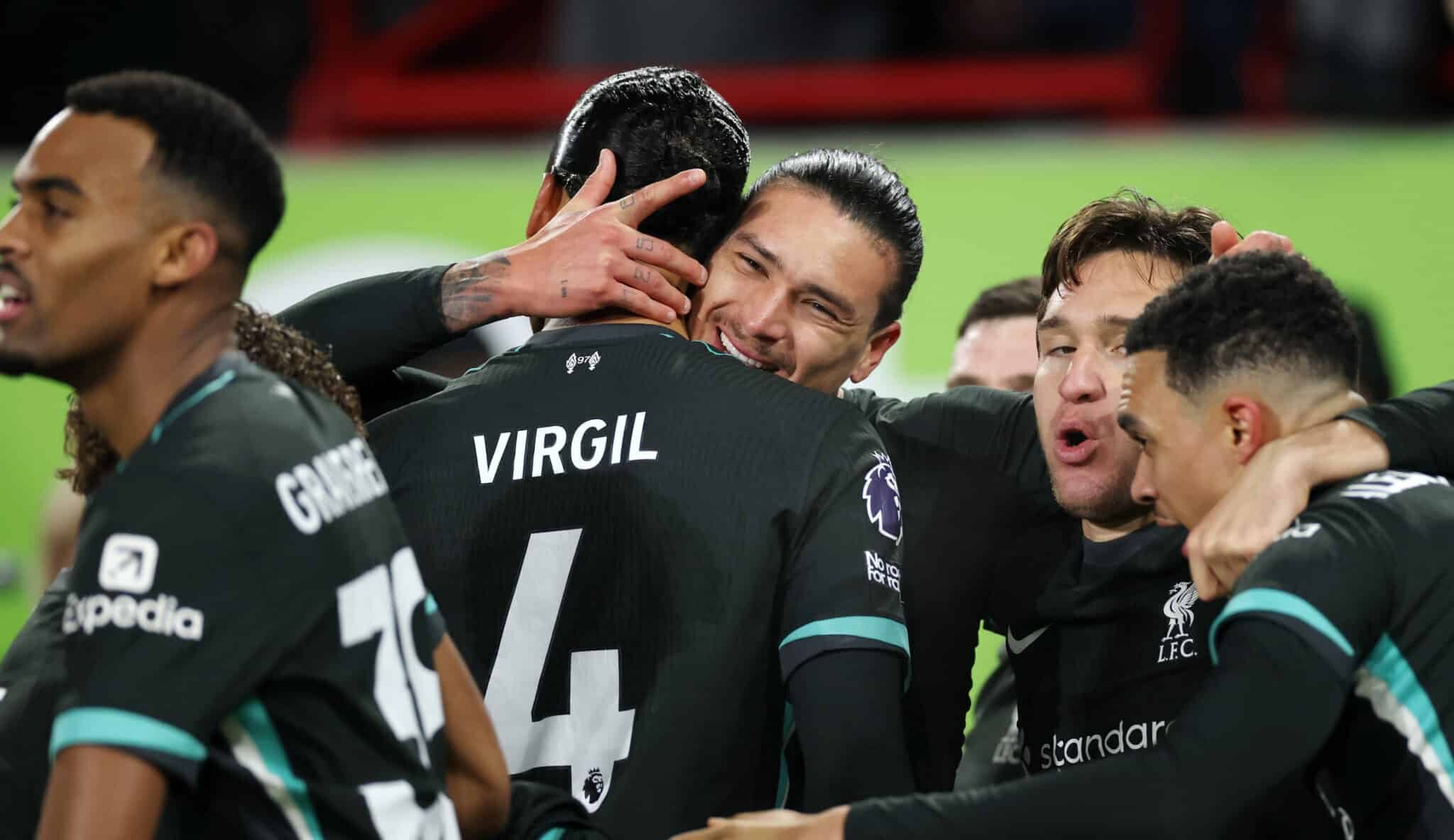 Darwin Nunez of Liverpool celebrates scoring his team's first goal with teammates Virgil van Dijk and Federico Chiesa during the Premier League match between Brentford FC and Liverpool FC at Gtech Community Stadium on January 18, 2025 in Brentford, England.