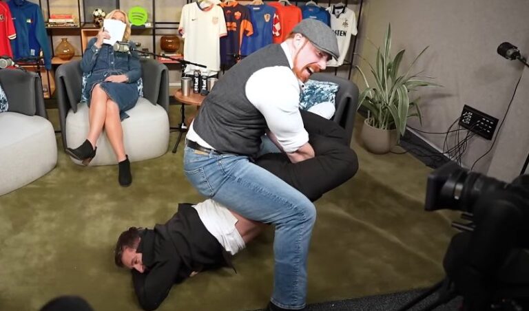 WWE wrestler Sheamus makes Gary Neville submit after putting him in a cloverleaf submission.