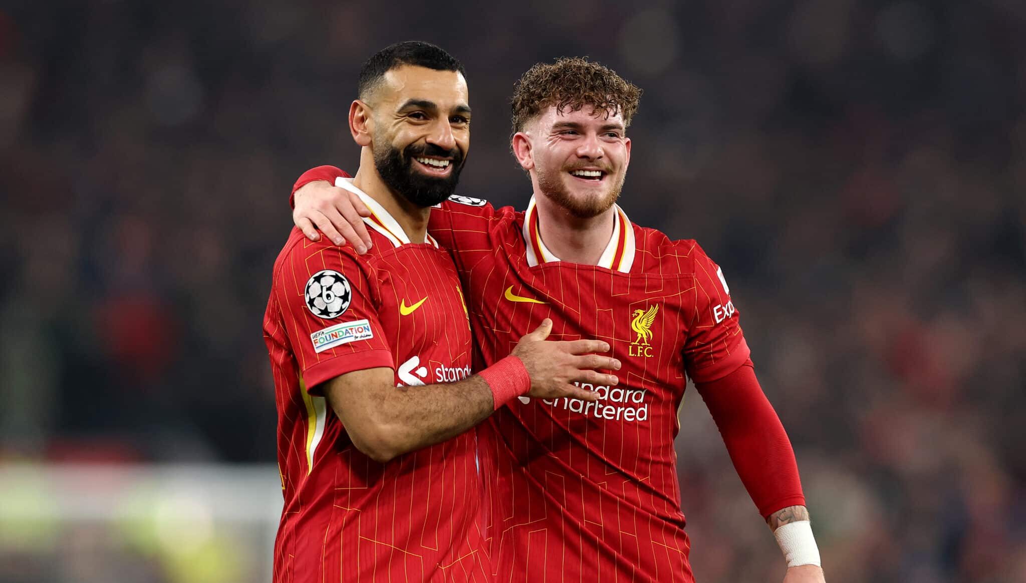 Harvey Elliott of Liverpool celebrates with teammate Mohamed Salah after scoring his team's second goal during the UEFA Champions League 2024/25 League Phase MD7 match between Liverpool FC and LOSC Lille at Anfield on January 21, 2025 in Liverpool, England.