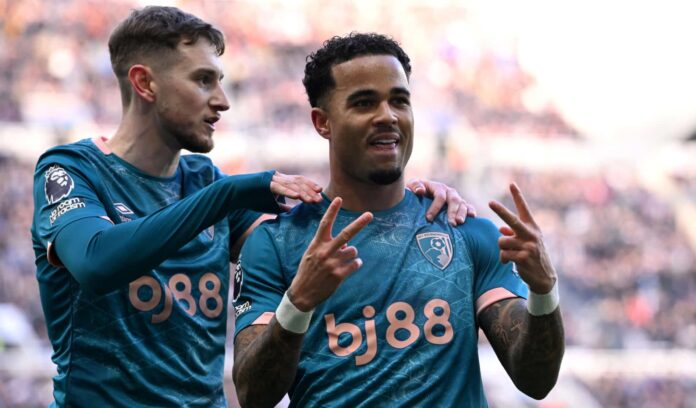 Justin Kluivert of AFC Bournemouth celebrates scoring the second goal of his hat-trick with teammate David Brooks during the Premier League match between Newcastle United FC and AFC Bournemouth at St James' Park on January 18, 2025 in Newcastle upon Tyne, England.