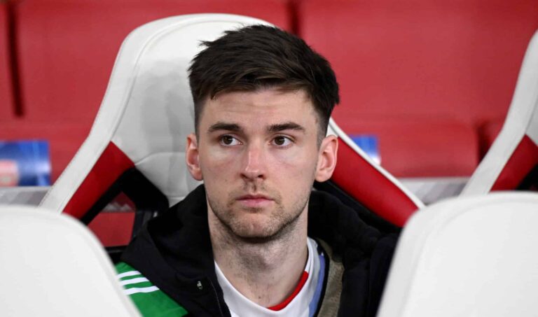 Kieran Tierney of Arsenal looks on as he sits on the substitutes bench prior to the UEFA Champions League 2024/25 League Phase MD6 match between Arsenal FC and AS Monaco at Emirates Stadium on December 11, 2024 in London, England.