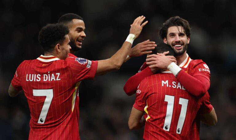 Mo Salah of Liverpool celebrates scoring his team's fifth goal with teammates Dominik Szoboszlai, Cody Gakpo and Luis Diaz during the Premier League match between Tottenham Hotspur FC and Liverpool FC at Tottenham Hotspur Stadium on December 22, 2024 in London, England.