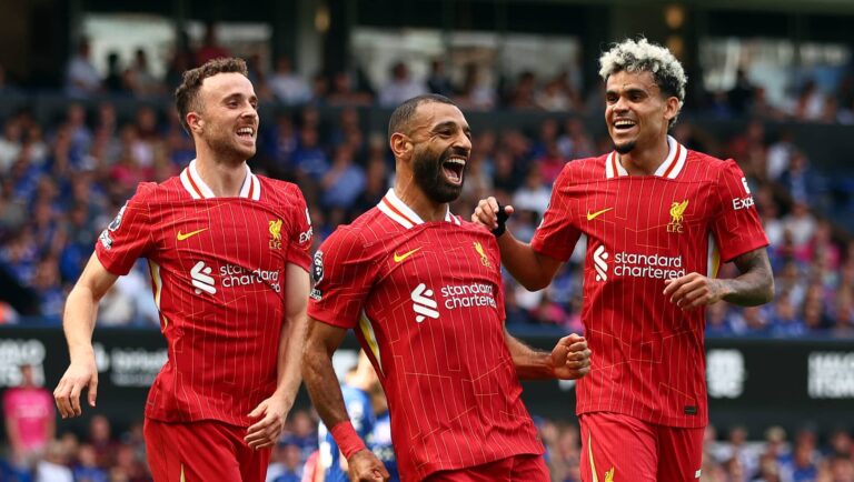 Mo Salah of Liverpool celebrates scoring his team's second goal with teammates Diogo Jota and Luis Diaz during the Premier League match between Ipswich Town FC and Liverpool FC at Portman Road on August 17, 2024 in Ipswich, England.