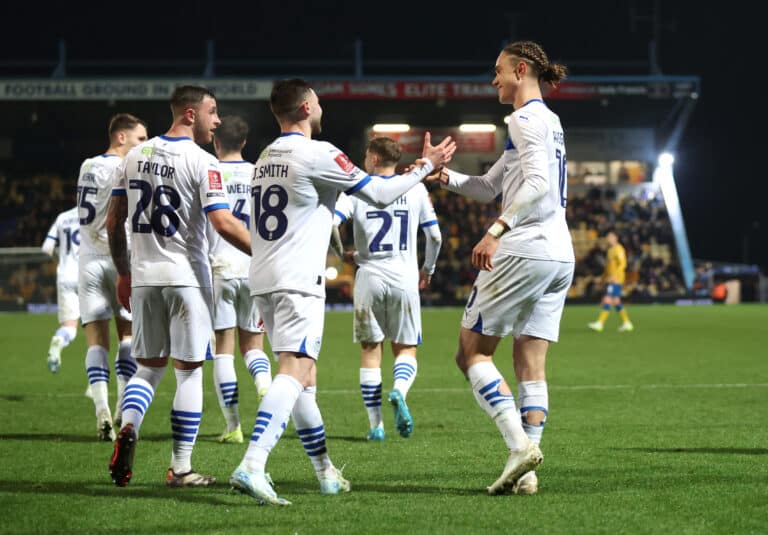 Thelo Aasgaard of Wigan Athletic celebrates scoring his team's second goal with Jonny Smith of Wigan Athletic during the Emirates FA Cup Third Round match between Mansfield Town and Wigan Athletic at Field Mill on January 14, 2025 in Mansfield, England.