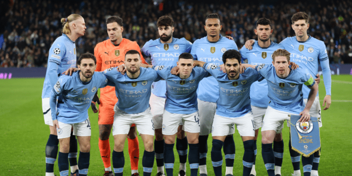 Manchester City players line up for a team photo.