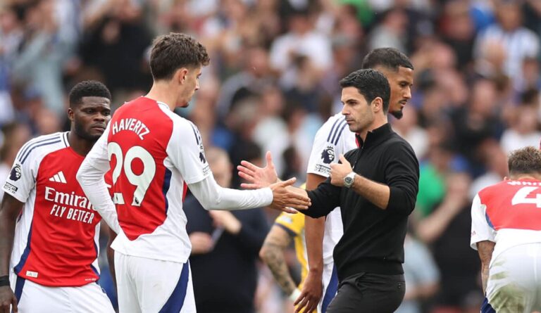 Kai Havertz of Arsenal and Mikel Arteta, Manager of Arsenal, interact following the Premier League match between Arsenal FC and Brighton & Hove Albion FC at Emirates Stadium on August 31, 2024 in London, England.