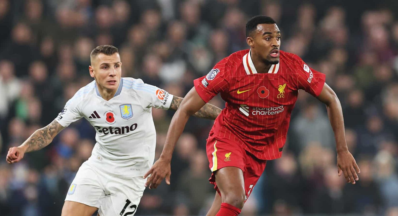 Ryan Gravenberch of Liverpool is put under pressure by Lucas Digne of Aston Villa during the Premier League match between Liverpool FC and Aston Villa FC at Anfield on November 09, 2024 in Liverpool, England.