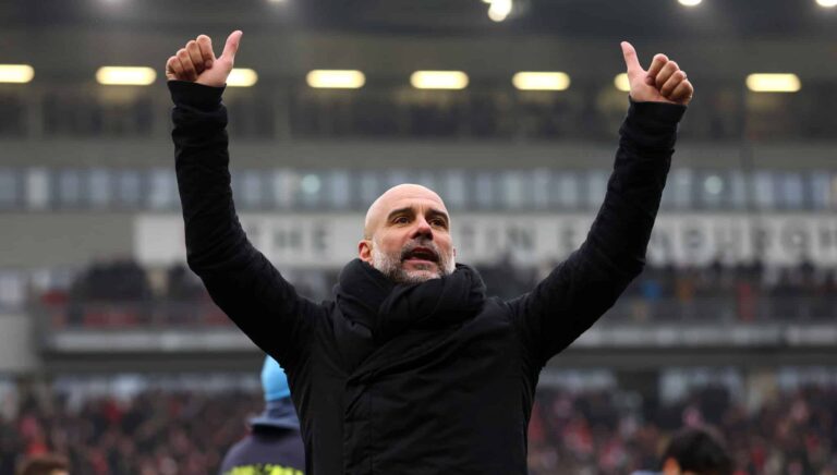 Pep Guardiola, Manager of Manchester City, gives a thumbs up as he celebrates victory following the Emirates FA Cup Fourth Round match between Leyton Orient and Manchester City at Gaughan Group Stadium on February 08, 2025 in London, England.