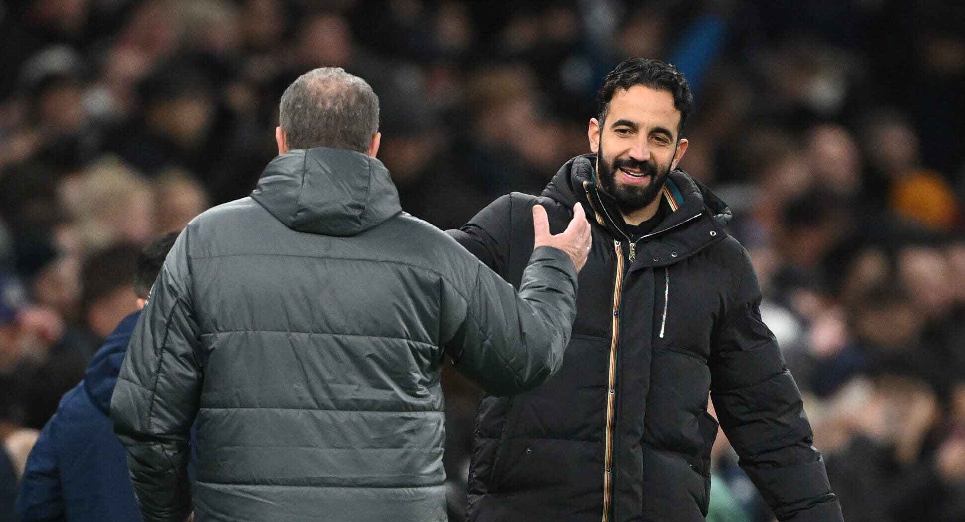 Ruben Amorim, Manager of Man Utd, congratulates Ange Postecoglou, Manager of Spurs, at the end of the Carabao Cup Quarter Final match between Tottenham Hotspur and Manchester United at Tottenham Hotspur Stadium on December 19, 2024 in London, England.