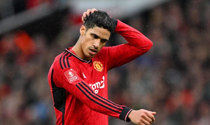 Raphael Varane of Manchester United reacts during the Emirates FA Cup Quarter Final between Manchester United and Liverpool FC at Old Trafford on March 17, 2024 in Manchester, England.
