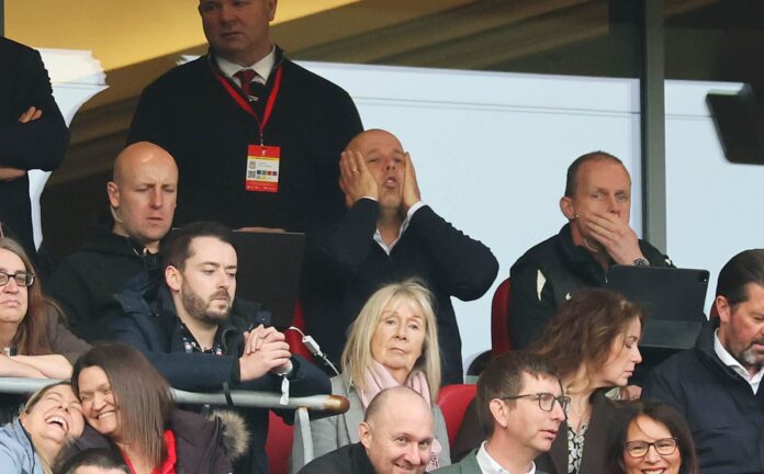 Arne Slot, Manager of Liverpool, reacts from the stand, while he serves a two game touchline ban during the Premier League match between Liverpool FC and Southampton FC at Anfield on March 08, 2025 in Liverpool, England.