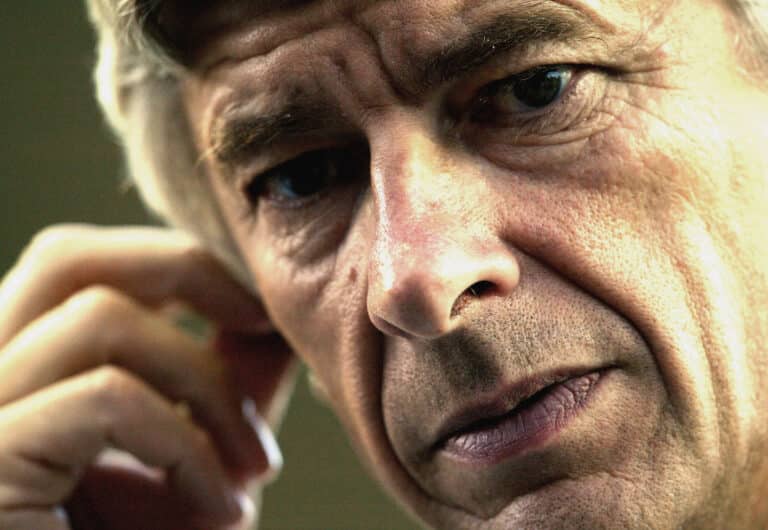 Former Arsenal manager Arsene Wenger prepares for a television interview during the Confederations Cup Group A match between France and Japan at the Stade Geoffroy-Guichard on June 20, 2003 in Saint-Etienne, France.