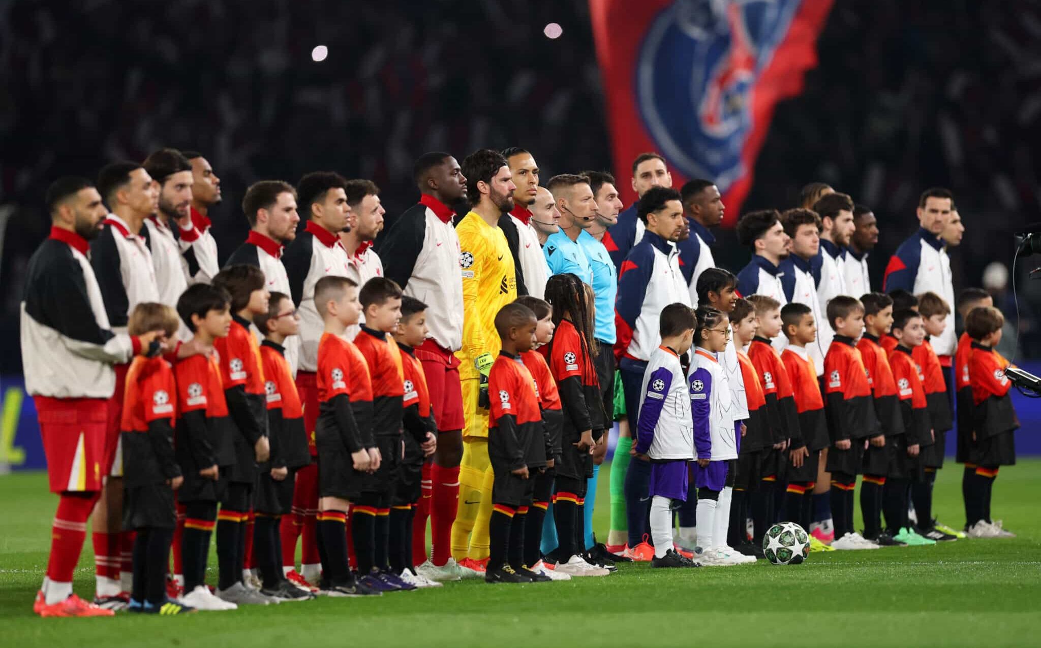 Liverpool and PSG players line-up prior to the UEFA Champions League 2024/25 Round of 16 first leg match between Paris Saint-Germain and Liverpool FC at Parc des Princes on March 05, 2025 in Paris, France.