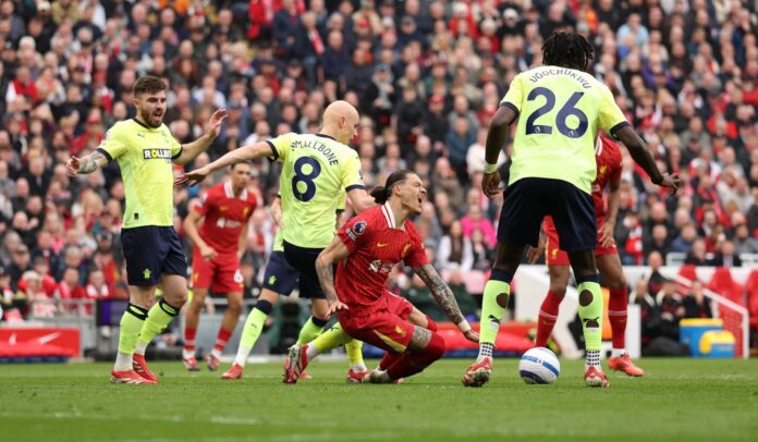 Southampton midfielder Will Smallbone fouls Darwin Nunez of Liverpool, resulting in a penalty kick being awarded during the Premier League match between Liverpool FC and Southampton FC at Anfield on March 08, 2025 in Liverpool, England.