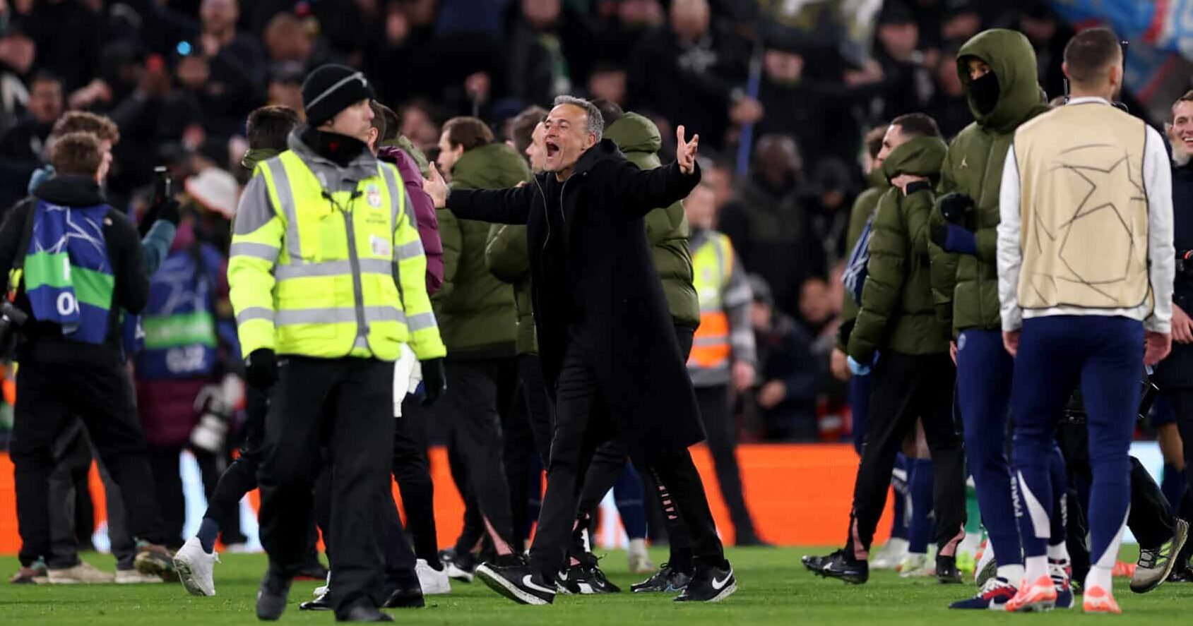 Luis Enrique, Head Coach of Paris Saint-Germain, celebrates after the team's victory in the UEFA Champions League 2024/25 Round of 16 Second Leg match between Liverpool FC and Paris Saint-Germain at Anfield on March 11, 2025 in Liverpool, England.