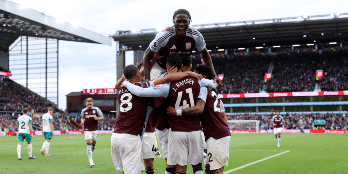 Aston Villa players celebrate a goal in the Premier League.