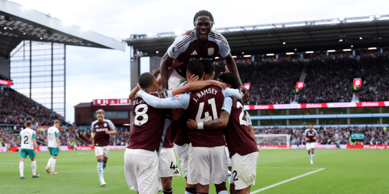 Aston Villa players celebrate a goal in the Premier League.