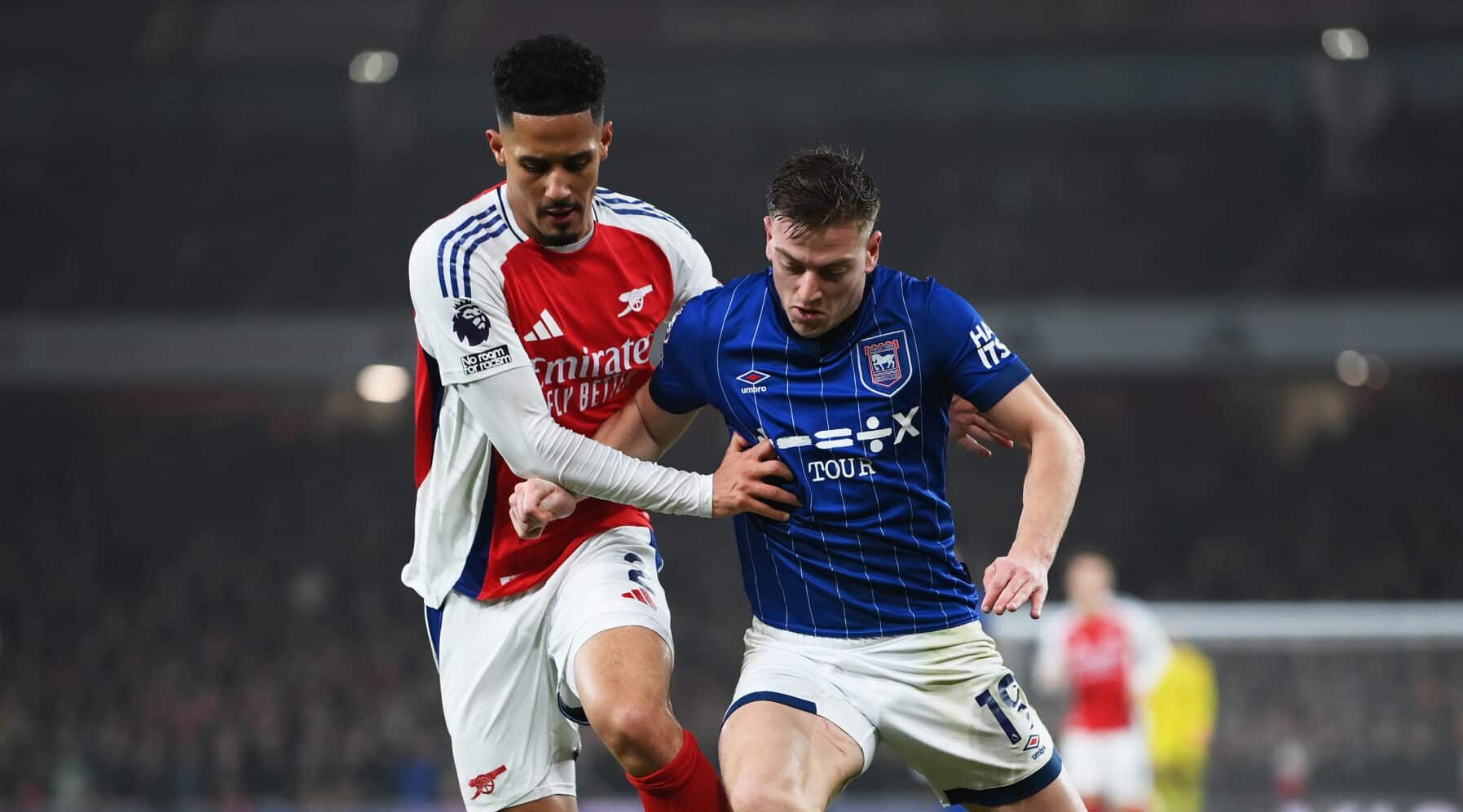 Arsenal defender William Saliba challenges Liam Delap of Ipswich Town during the Premier League match between Arsenal FC and Ipswich Town FC at Emirates Stadium on December 27, 2024 in London, England.