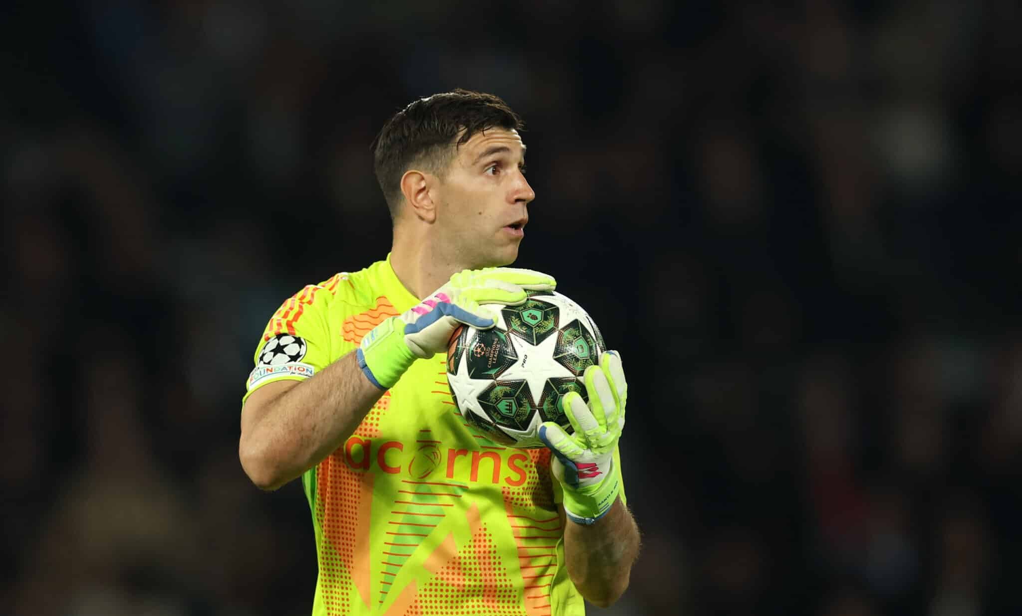 Aston Villa goalkeeper Emiliano Martinez looks on with the ball during the UEFA Champions League 2024/25 Quarter Final First Leg match between Paris Saint-Germain and Aston Villa FC at Parc des Princes on April 09, 2025 in Paris, France.