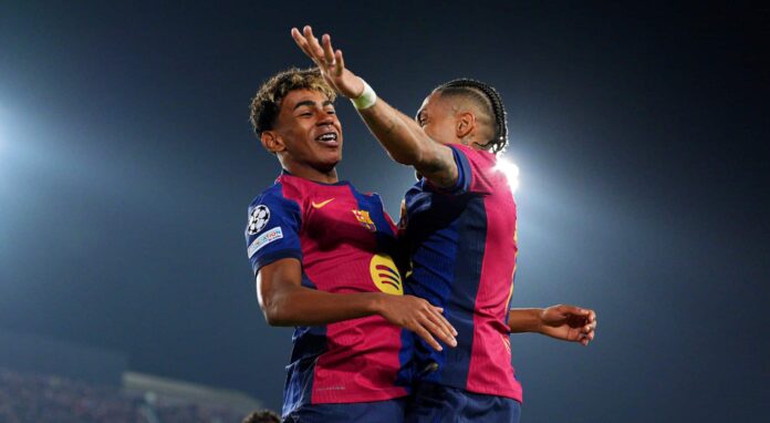 Lamine Yamal of FC Barcelona (L) celebrates scoring his team's fourth goal with teammate Raphinha (R) during the UEFA Champions League 2024/25 Quarter Final First Leg match between FC Barcelona and Borussia Dortmund at Estadi Olimpic Lluis Companys on April 09, 2025 in Barcelona, Spain.