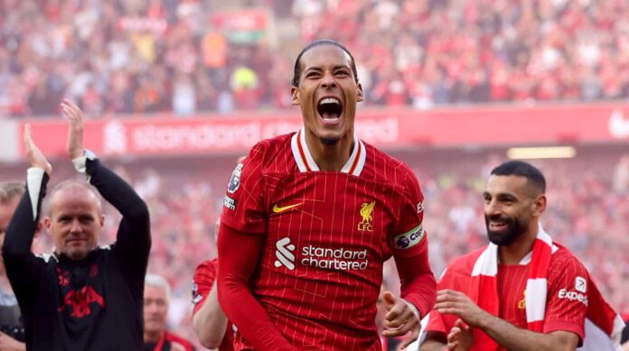 Virgil van Dijk of Liverpool celebrates the teams victory and confirmation of winning the Premier League title in the Premier League match between Liverpool FC and Tottenham Hotspur FC at Anfield on April 27, 2025 in Liverpool, England.