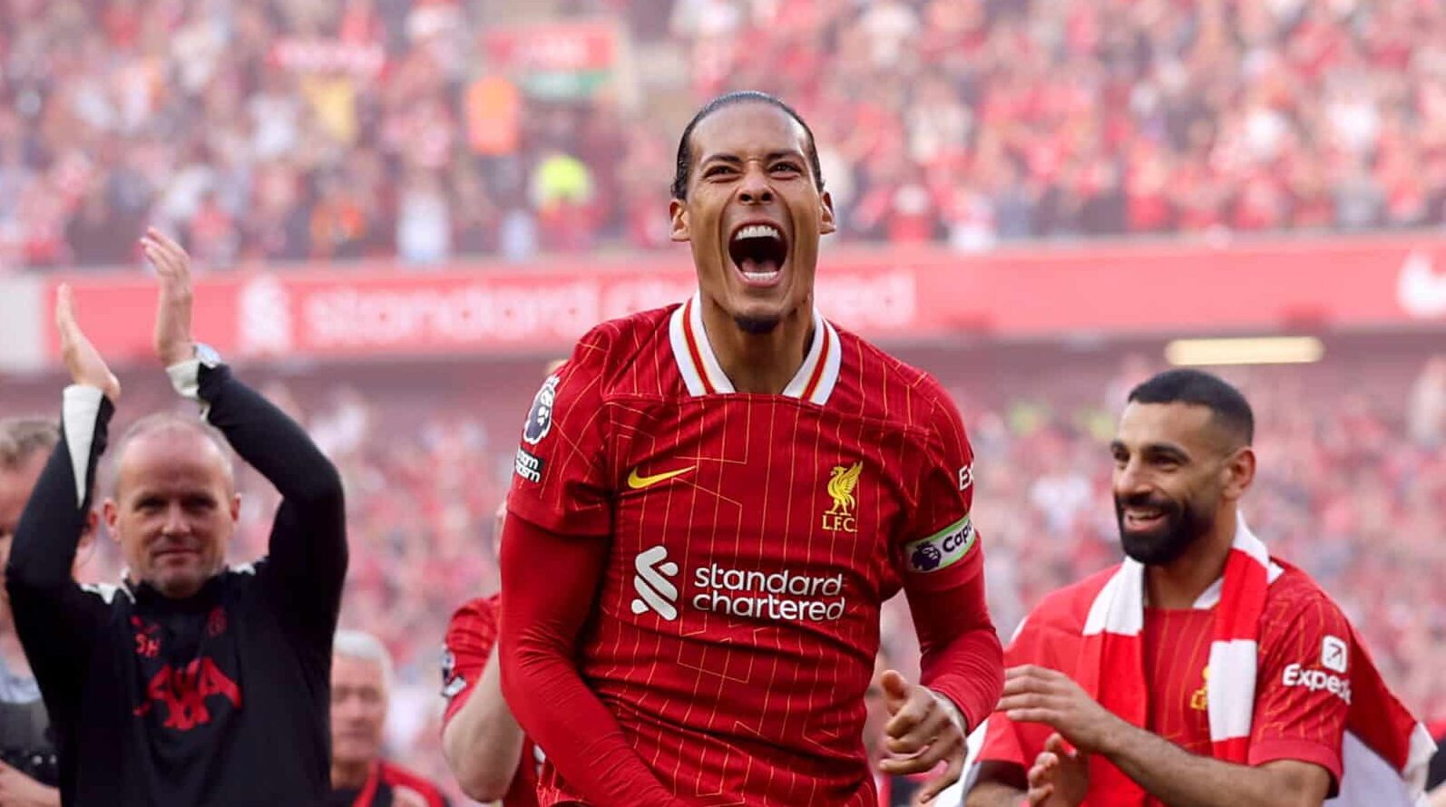 Virgil van Dijk of Liverpool celebrates the teams victory and confirmation of winning the Premier League title in the Premier League match between Liverpool FC and Tottenham Hotspur FC at Anfield on April 27, 2025 in Liverpool, England.
