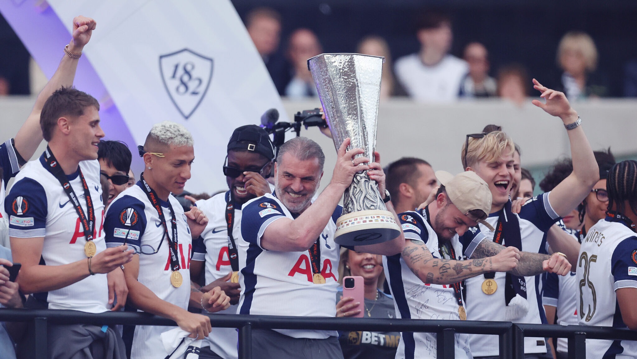 Ange Postecoglou, Manager of Spurs, lifts the UEFA Europa League trophy during the Tottenham Hotspur UEFA Europa League trophy parade on May 23, 2025 in London, England. Spurs defeated Manchester United in the final in Bilbao on May 21 to win their first major trophy in 17 years.