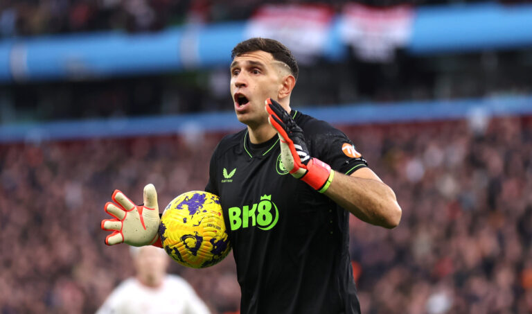 Emi Martinez of Aston Villa reacts during the Premier League match between Aston Villa and Manchester United at Villa Park on February 11, 2024 in Birmingham, England.
