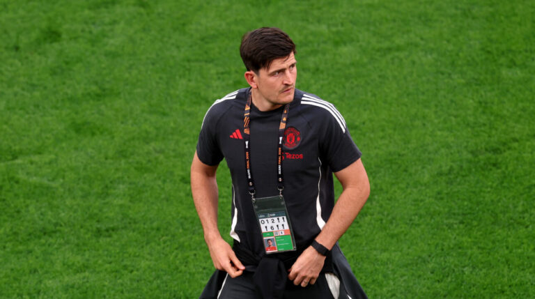 Harry Maguire of Manchester United inspects the pitch during a stadium walk around ahead of the UEFA Europa League Final 2025 between Tottenham Hotspur and Manchester United at Estadio de San Mames on May 20, 2025 in Bilbao, Spain.