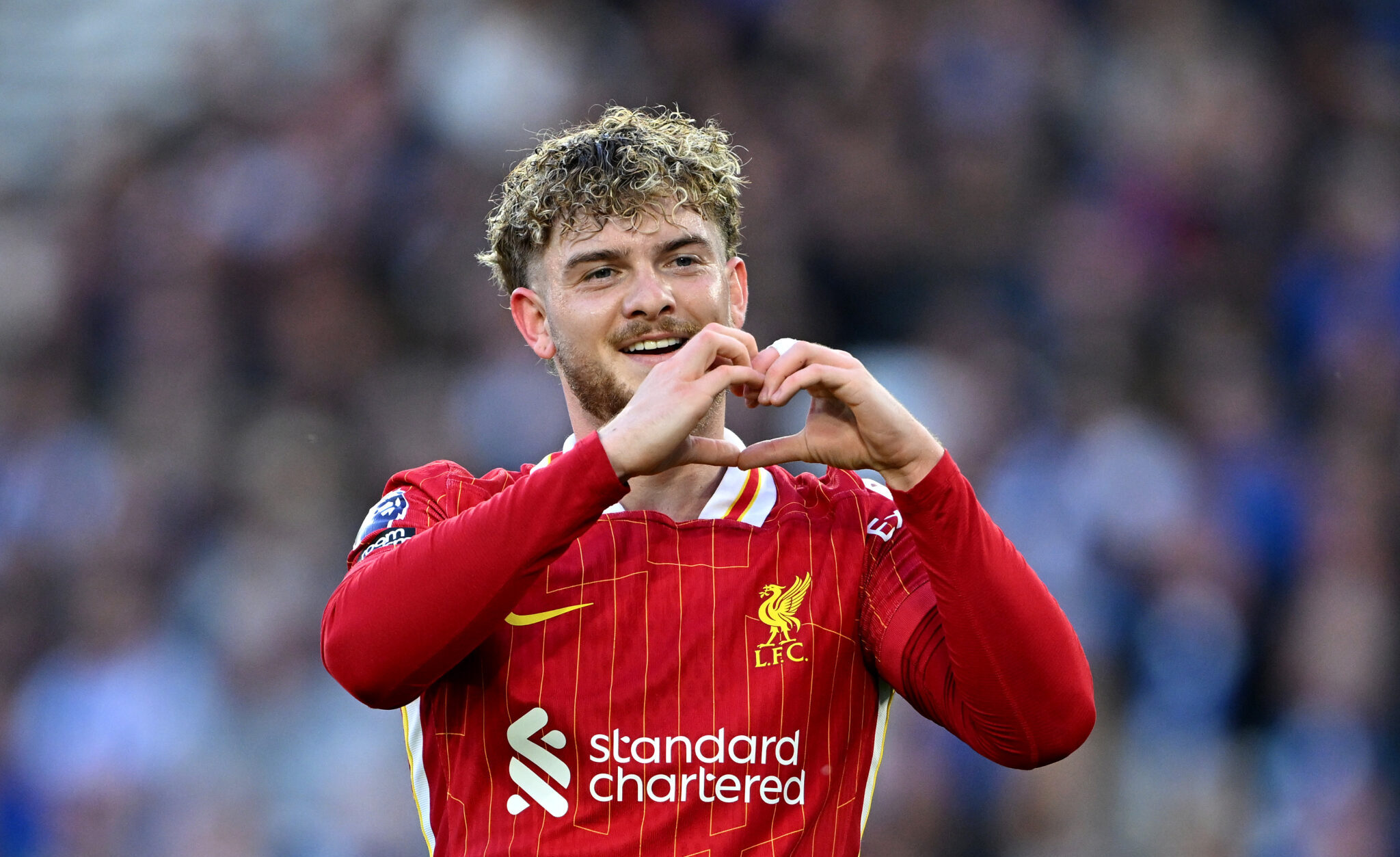 Harvey Elliott of Liverpool celebrates scoring his team's first goal during the Premier League match between Brighton & Hove Albion FC and Liverpool FC at Amex Stadium on May 19, 2025 in Brighton, England.