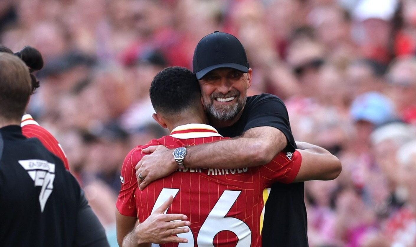 Jurgen Klopp, Manager of Liverpool, embraces Trent Alexander-Arnold of Liverpool after he is substituted during the Premier League match between Liverpool FC and Wolverhampton Wanderers at Anfield on May 19, 2024 in Liverpool, England.