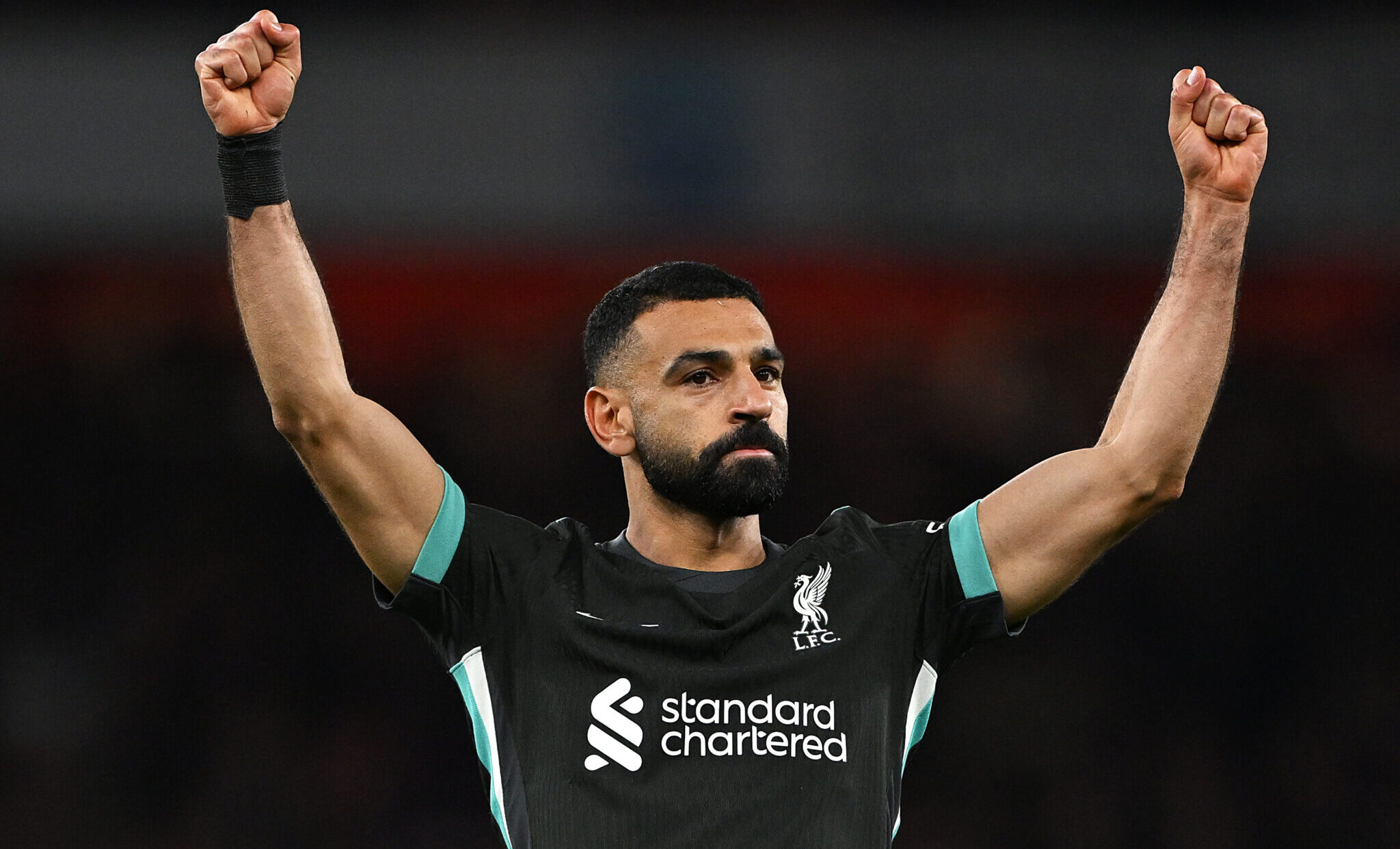Liverpool player Mo Salah celebrates scoring his team's second goal during the Premier League match between Arsenal FC and Liverpool FC at Emirates Stadium on October 27, 2024 in London, England.