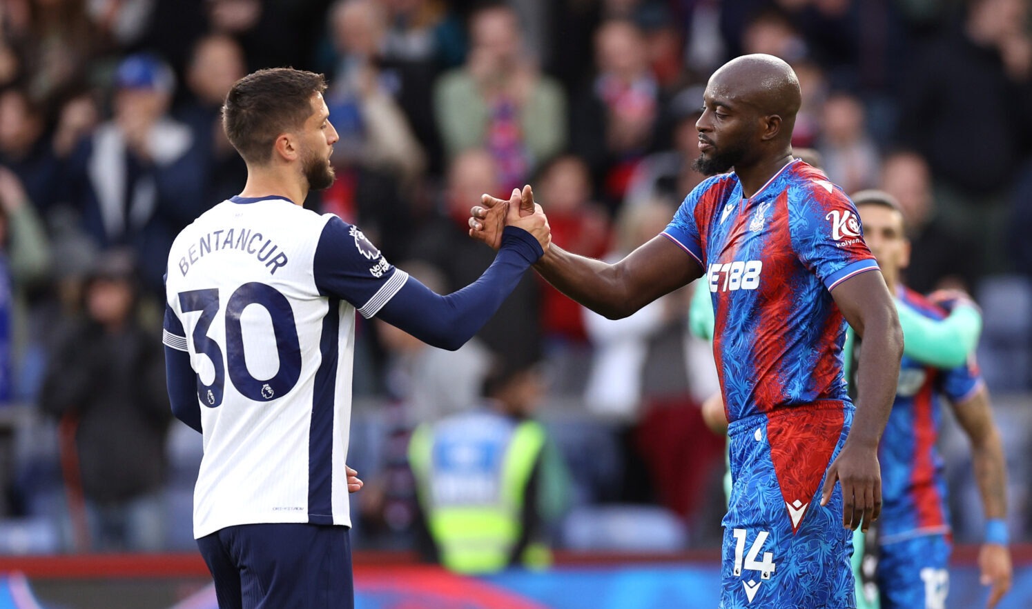 Spurs player Rodrigo Bentancur shakes hands with Jean-Philippe Mateta of Crystal Palace after the Premier League match between Crystal Palace FC and Tottenham Hotspur FC at Selhurst Park on October 27, 2024 in London, England.