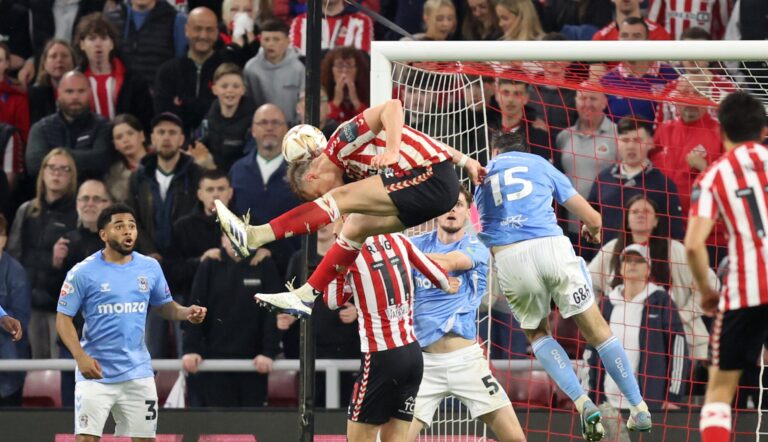 Daniel Ballard of Sunderland scores his team's first goal during the Sky Bet Championship Play-Off Semi Final Second Leg match between AFC Sunderland and Coventry City at Stadium of Light on May 13, 2025 in Sunderland, England.