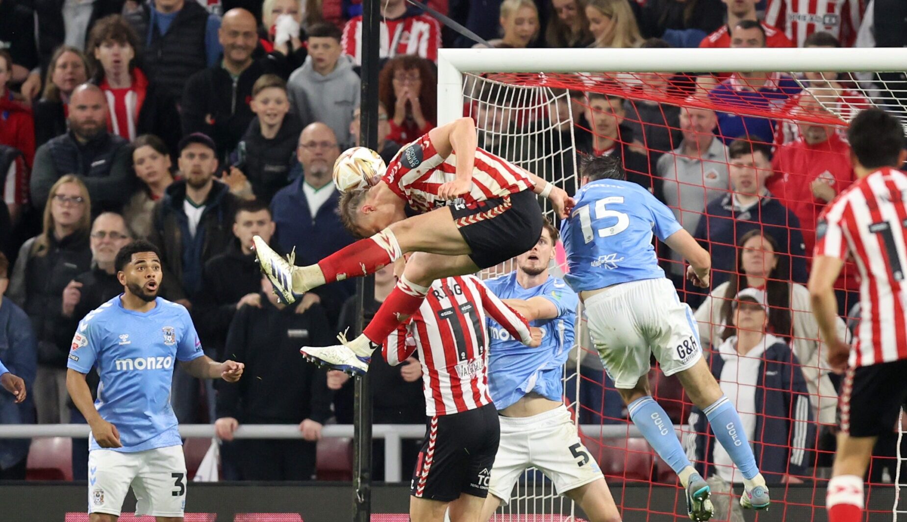Daniel Ballard of Sunderland scores his team's first goal during the Sky Bet Championship Play-Off Semi Final Second Leg match between AFC Sunderland and Coventry City at Stadium of Light on May 13, 2025 in Sunderland, England.