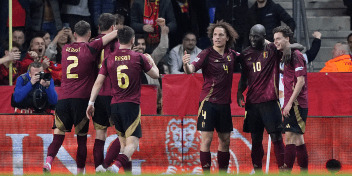 Belgium players celebrate a goal.