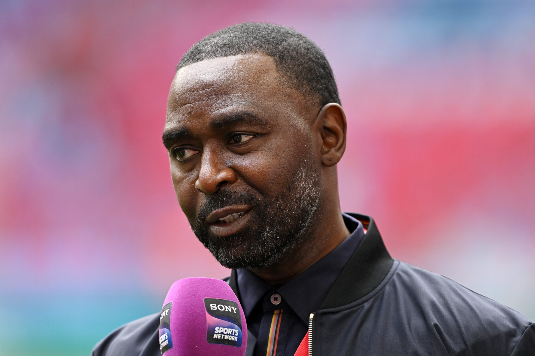 Andy Cole, former Man Utd striker, looks on prior to the Emirates FA Cup Final match between Manchester City and Manchester United at Wembley Stadium on May 25, 2024 in London, England.