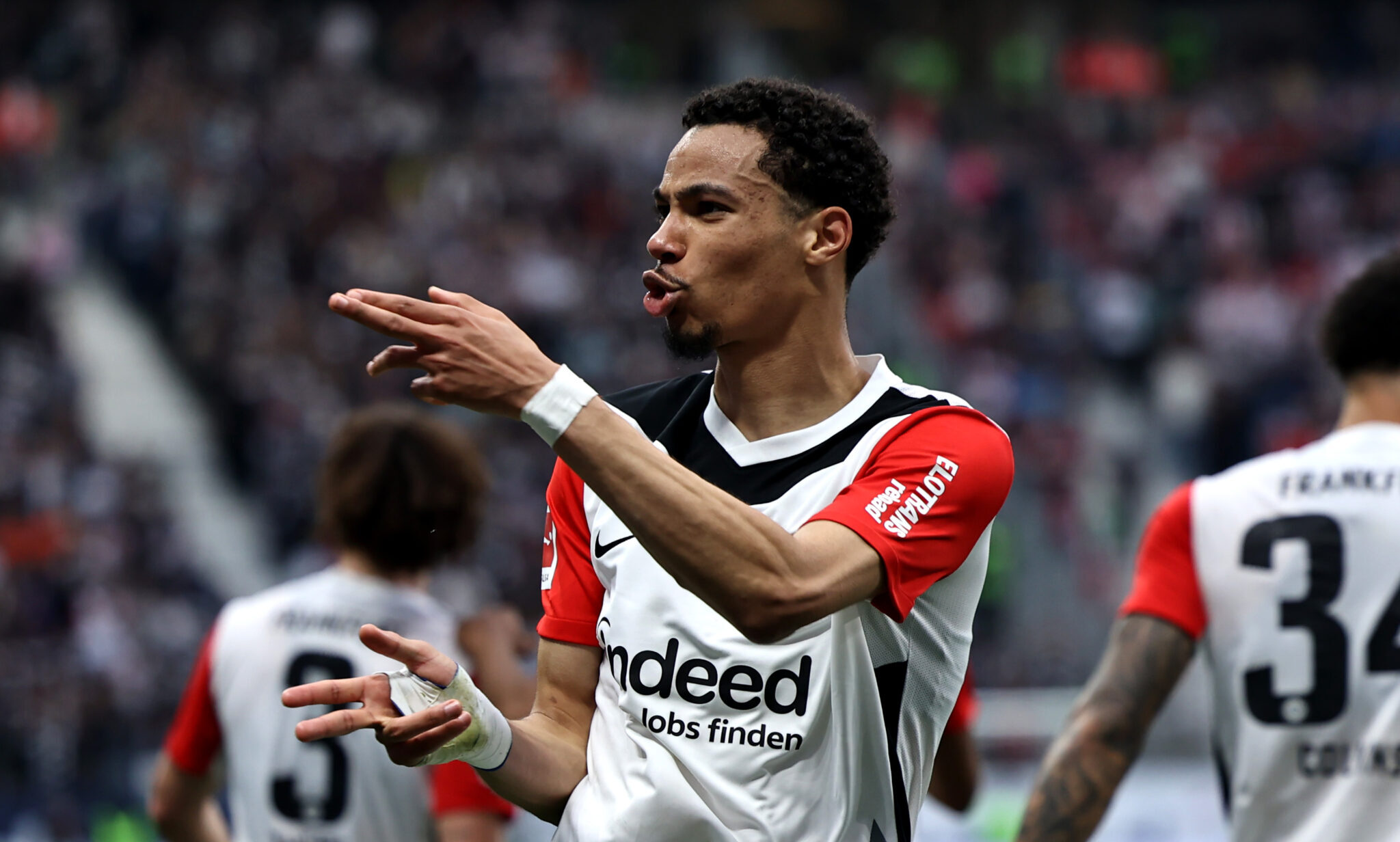 Hugo Ekitike of Eintracht Frankfurt celebrates scoring his team's third goal during the Bundesliga match between Eintracht Frankfurt and RB Leipzig at Deutsche Bank Park on April 26, 2025 in Frankfurt am Main, Germany.