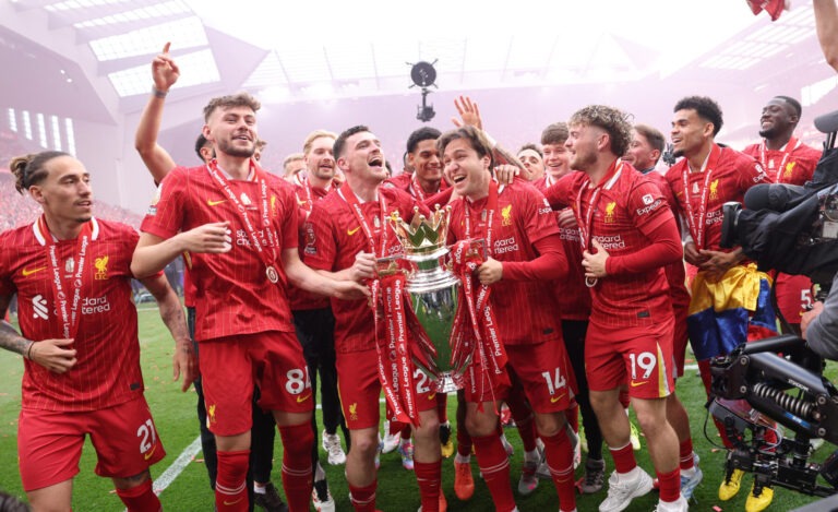 Liverpool players Andy Robertson and Federico Chiesa celebrate with Premier League trophy, as Liverpool are crowned the Champions of the Premier League for the 2024/25 Season, following the Premier League match between Liverpool FC and Crystal Palace FC at Anfield on May 25, 2025 in Liverpool, England.