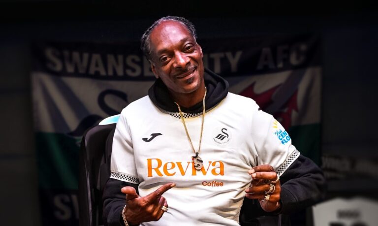 Celebrities who have invested in British football clubs - Snoop Dogg wearing a Swansea City jersey after announcing he is a minority investor in the club.