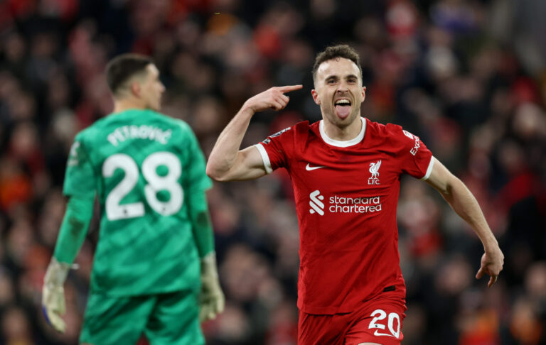 Diogo Jota of Liverpool celebrates scoring his team's first goal during the Premier League match between Liverpool FC and Chelsea FC at Anfield on January 31, 2024 in Liverpool, England.