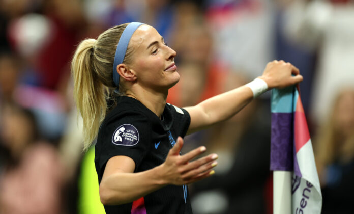 England player Chloe Kelly celebrates scoring her team's second goal from a rebound following a saved penalty in extra-time during the UEFA Women's EURO 2025 Semi-Final match between England and Italy at Stade de Geneve on July 22, 2025 in Geneva, Switzerland.