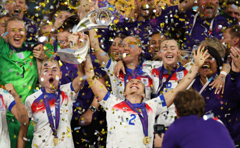 Lucy Bronze and Alex Greenwood (left) of England celebrate with the UEFA Women's EURO trophy after their team's victory in the UEFA Women's EURO 2025 Final match between England and Spain at St. Jakob-Park on July 27, 2025 in Basel, Switzerland.