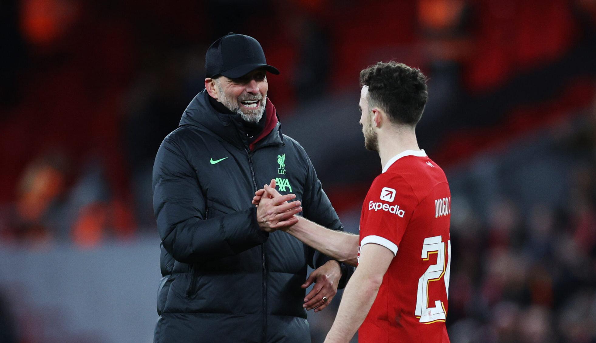 Jurgen Klopp, former manager of Liverpool, and Diogo Jota of Liverpool interact following the team's victory in the Carabao Cup Semi Final First Leg match between Liverpool and Fulham at Anfield on January 10, 2024 in Liverpool, England.